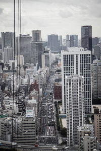 High angle view of buildings in city against sky