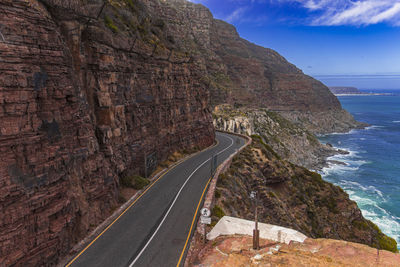 Road by sea against sky