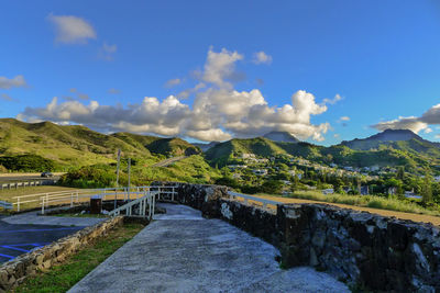 Scenic view of mountains against blue sky