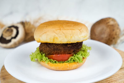 Close-up of burger in plate on table