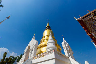 Low angle view of traditional building against blue sky