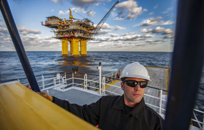 Portrait of man in sea against sky