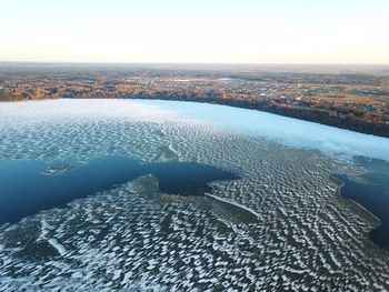 Scenic view of sea against clear sky during winter