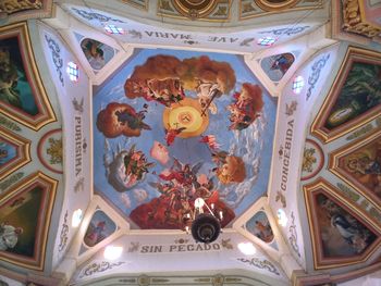 Low angle view of ornate ceiling in building