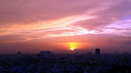 Cityscape against sky during sunset