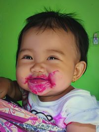 Close-up of cute baby girl eating food