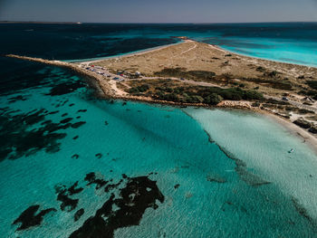 High angle view of sea shore against sky