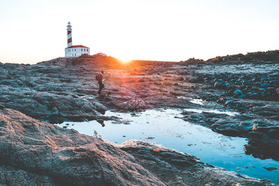 Scenic view of lighthouse against sky during sunset