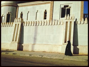 Woman in front of building