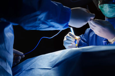 Low angle view of doctors operating patient
