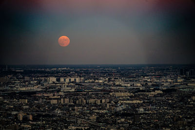 High angle view of city at sunset