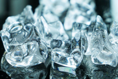 Group of ices with water on the slick ground.