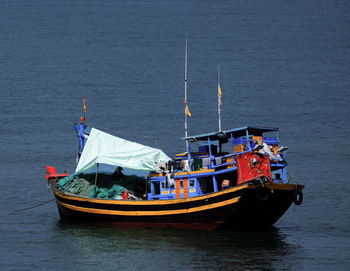 High angle view of fishing boat sailing in sea