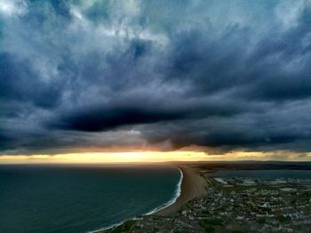 Scenic view of sea against cloudy sky