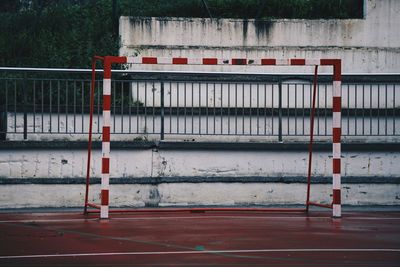 Built structure by fence against building