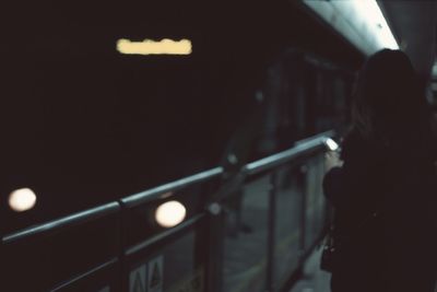 Blurred motion of woman at night
