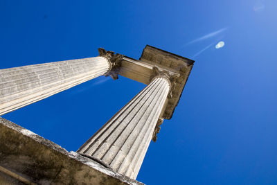 Low angle view of historic building against clear blue sky