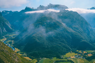 Aerial view of mountain range against sky