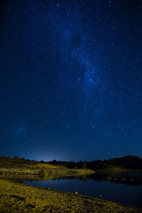 Scenic view of star field against blue sky