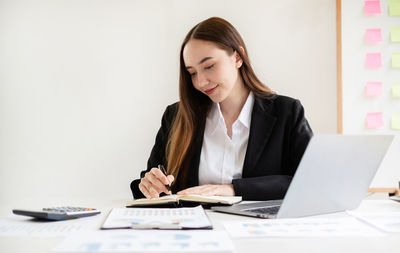 Businesswoman working on table