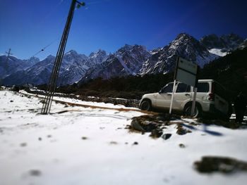 Snow covered landscape against sky