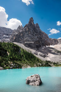 Scenic view of rocks in mountains against sky