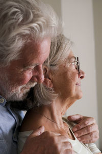 Side view of senior woman with daughter at home