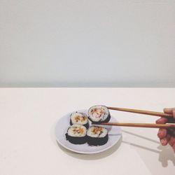 Hand holding food in plate