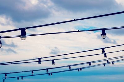 Low angle view of cables against sky