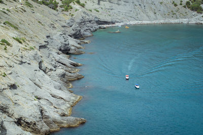 High angle view of rocks by sea