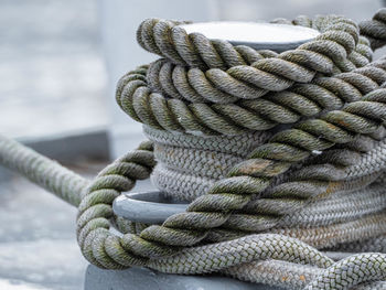 Close-up of rope tied to wooden post