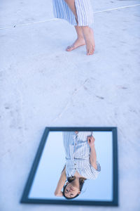 Low section of woman standing on floor