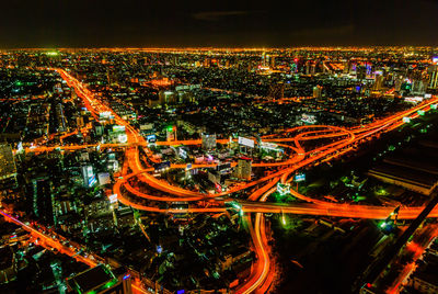 High angle view of illuminated buildings in city at night