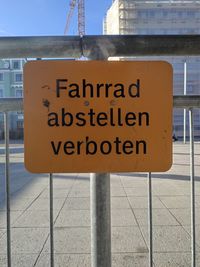 Close-up of information sign on road