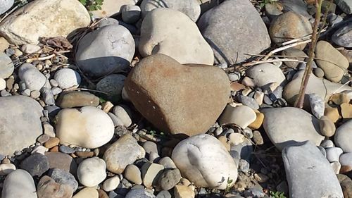 High angle view of stones on pebbles