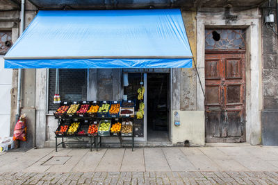 Fruits for sale at market stall outside building