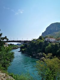 Bridge over river against sky