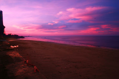 Scenic view of beach against sky during sunset