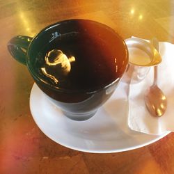 Close-up of coffee cup on table