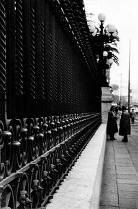 Rear view of people walking in city