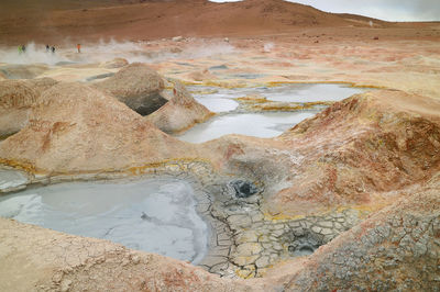Boiling mud lakes in sol de manana or the morning sun geothermal field, potosi department of bolivia