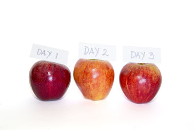 Close-up of apples on white background