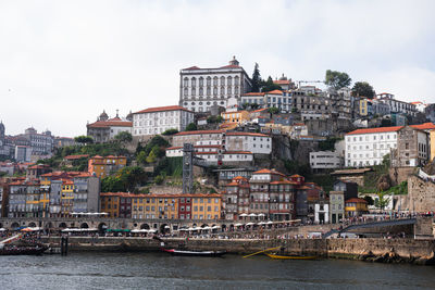 Buildings in city against sky