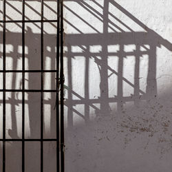 Shadow of railing on building
