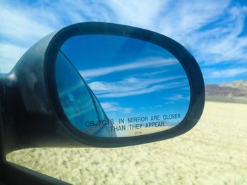 Close-up of reflection of clouds in water
