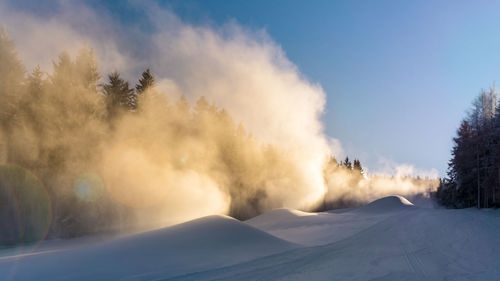 Panoramic view of snowcapped landscape against sky