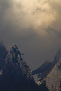 Rock formations in mountains against sky