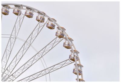 Cropped ferris wheel against clear sky