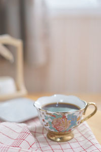 Close-up of tea cup on table