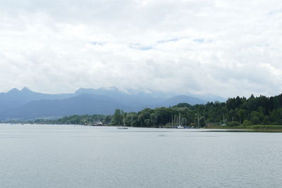 Scenic view of sea against cloudy sky